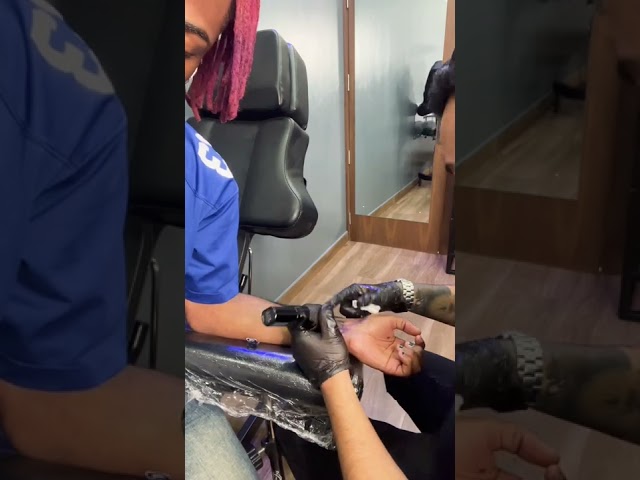 Getting a tattoo at Deepink Lagos