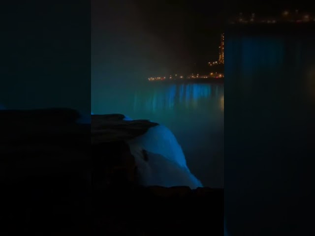 Under the Night Sky: Watching a Waterfall from the Cliff.