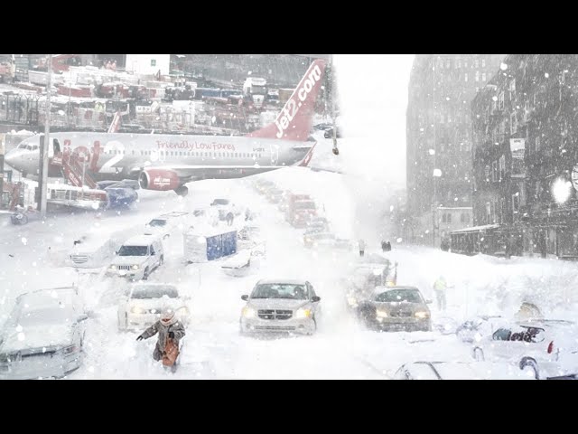 Chaos by Snow in UK! Manchester Airport is covered with snow, Snow Storm in Manchester