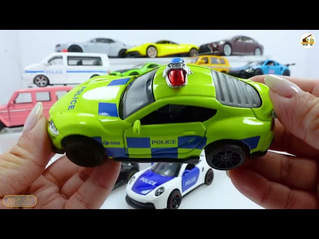 Mini metal toy cars, police cars, racing cars, off road vehicles, close up shots with toy cars