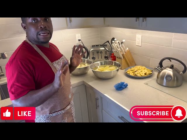 Kemar cooking curry chicken and provisions.