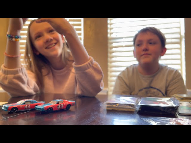 Brother & sister opening a Pokemon Sword & Shield Evolving Skies Elite Trainer Box