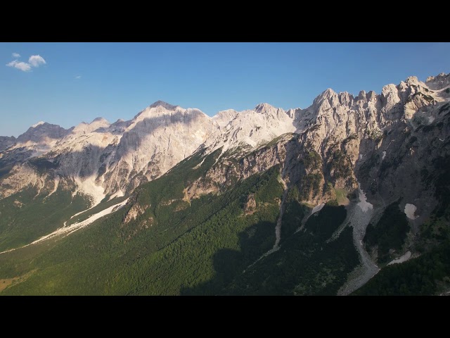 High mountains in albanian alps with rocky slope covered in green forest FREE STOCK VIDEO