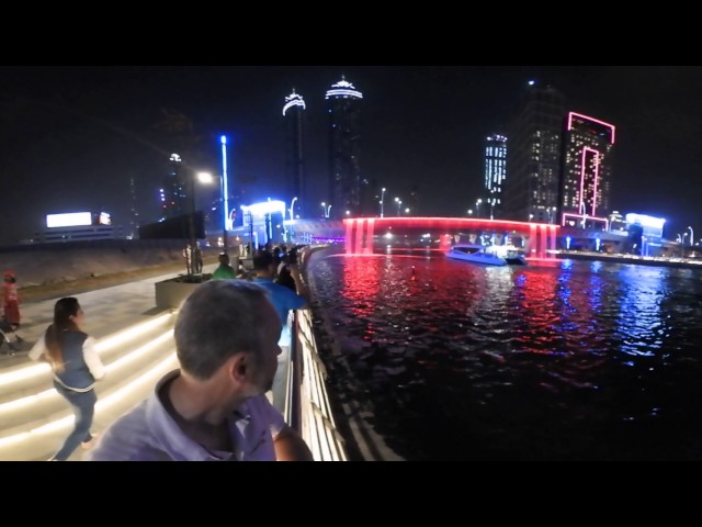 RTA water taxi goes under the Sheikh Zayed Road waterfall. (360 video)