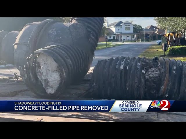 Concrete filled pipe removed after months of flooding problems in Florida neighborhood