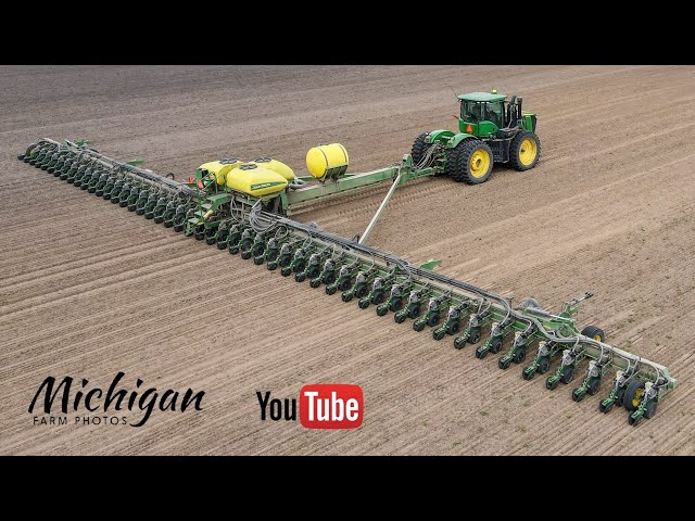 Huge John Deere DB120 48 row 30" 120' wide corn planter in action in Michigan!