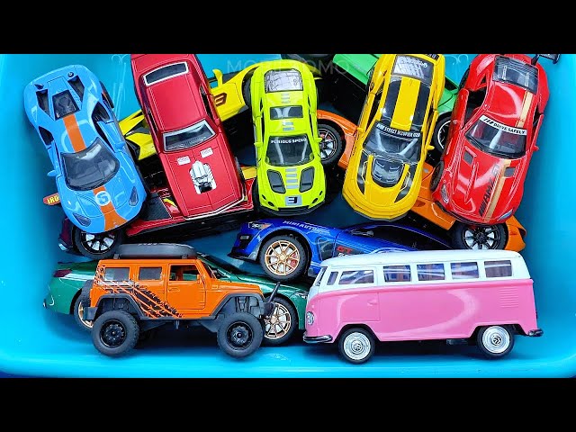 Box full of various miniature cars Jaguar, Peugeot, Renault, Hyundai, Mazda, Volvo, Honda, Opel