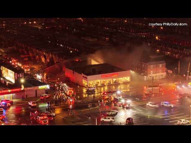 Drone shows burning and aircraft parts on road after Philadelphia small plane crash