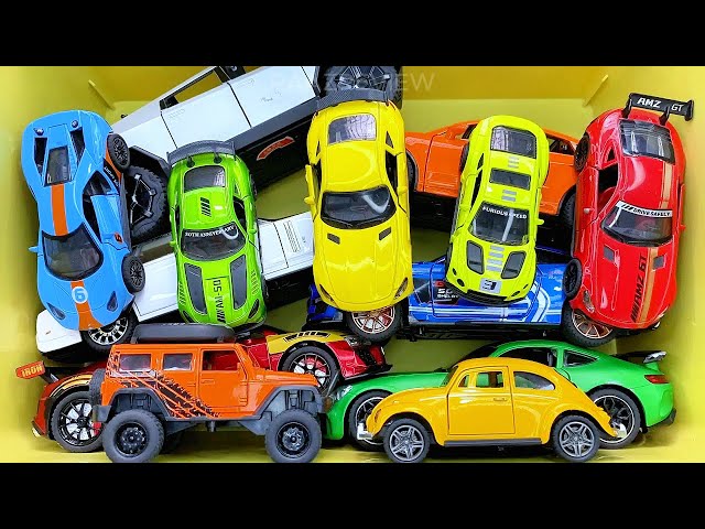 Box full of various miniature cars Peugeot, Volvo, Renault, Hyundai, Pagani, Cadillac One, DHL 13