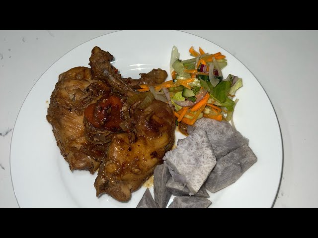 Chicken pot roast in frying pan Fiji Style with boiled taro