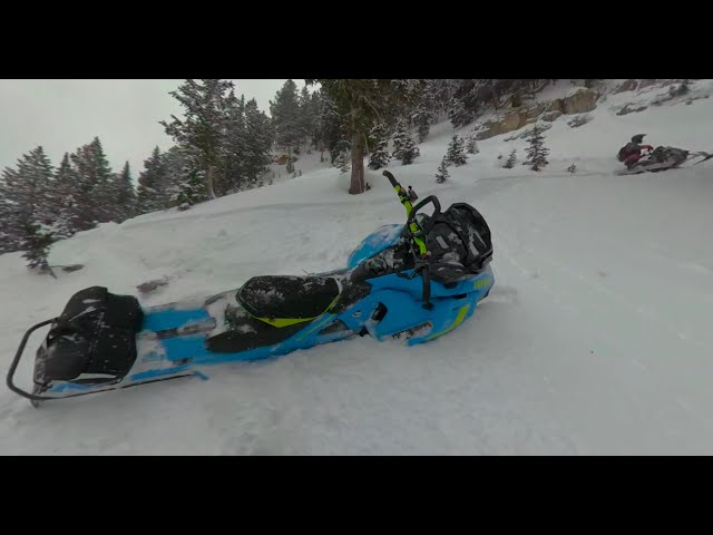 Hitting a land mine while pulling a sick sidehill - Snowmobile virtual reality 360.