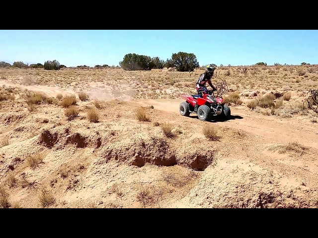 Cassandra jumping on her Honda TRX90