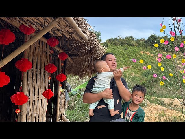 father and son prepare to celebrate Tet but without their mother