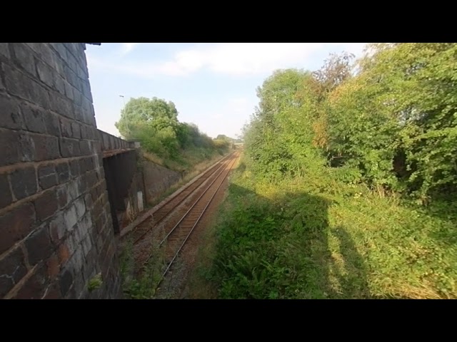 VR180° Short video of a couple of trains under the bridge