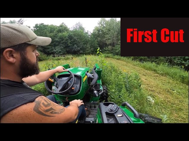 John Deere 4044M Bushhogging-brushhogging an overgrown lot