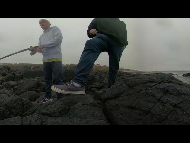 Learning to spin fish in Northern Ireland. Portstewart. Irish Coast filmed in 360 video.