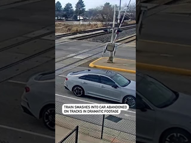 Train smashes into car abandoned on tracks in dramatic footage