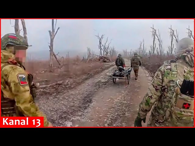 Left without equipment, Putin's soldiers carry dead bodies off battlefield in a wheelbarrow