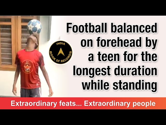 Football balanced on forehead by a teen for the longest duration while standing