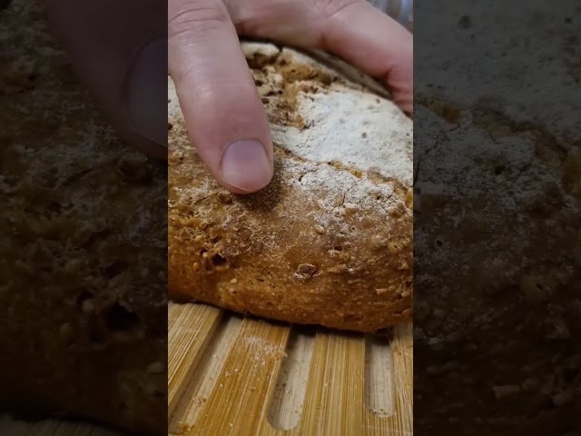 the first crunchy slice of six-grain homemade bread. Mother yeast long leavening #asmrsounds