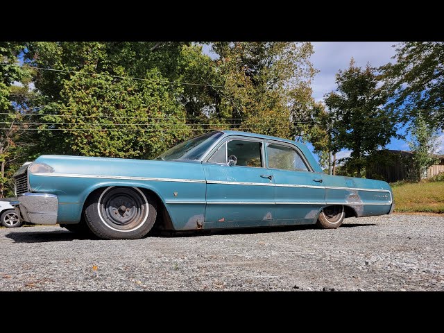 1964 Chevrolet Impala is finished and laying on the ground.