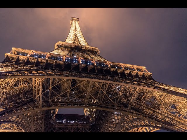 Walking down eiffel tower on a very windy night