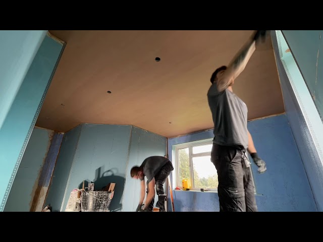 Plastering a ceiling