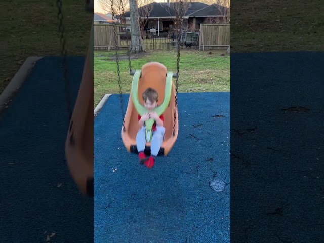 Capturing the Pure Joy of a Toddler's Swing Ride