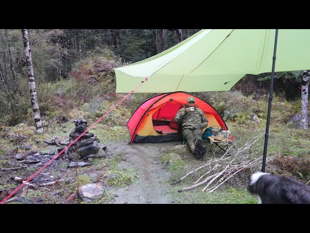 CAMPING in the RAIN - freezing cold - fire pit - tent