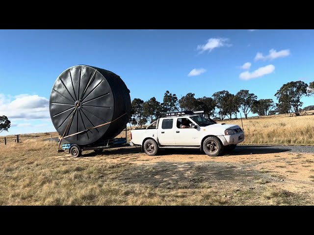 Wind Vs Tank: Moving our huge rainwater tank on a makeshift trailer down our boggy track|installing.