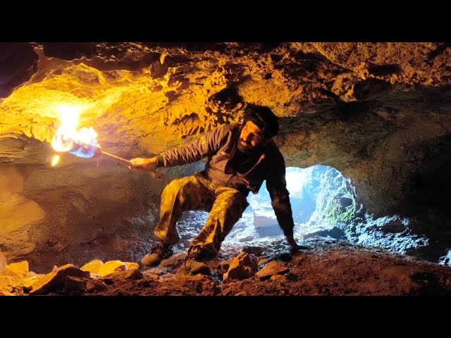 I transformed an amazing rock cave into a safe haven with a fireplace. #Camping #Mountains #Survival