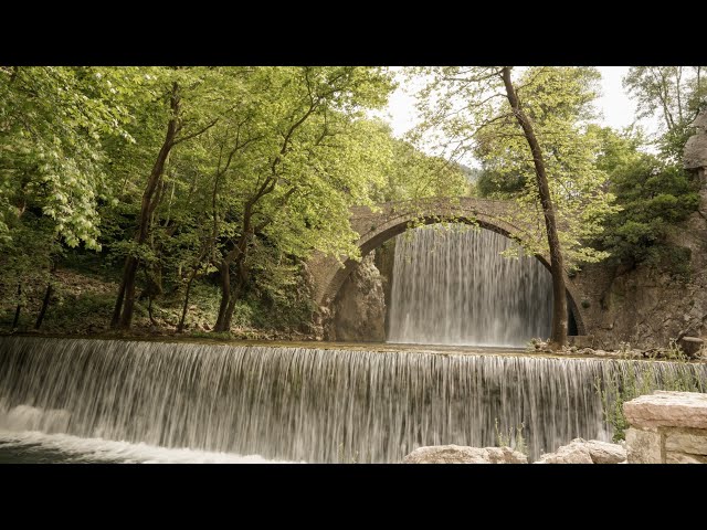 Stone bridge and waterfall of Palaiokarya Greece