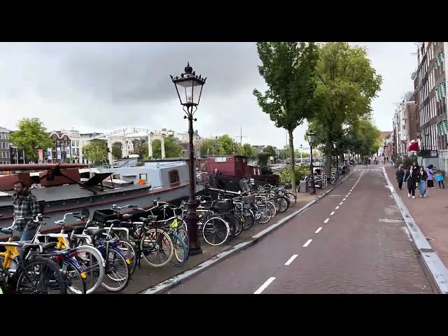 Experience Amsterdam By Bicycle: Ride with View Over the Iconic Amstel River Bridge On 4K City Tour!