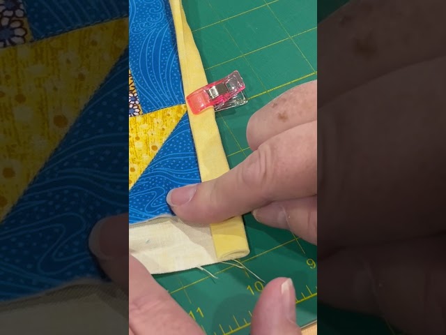 How to do a Mitered Corner when Binding a Quilt using the Backing Fabric