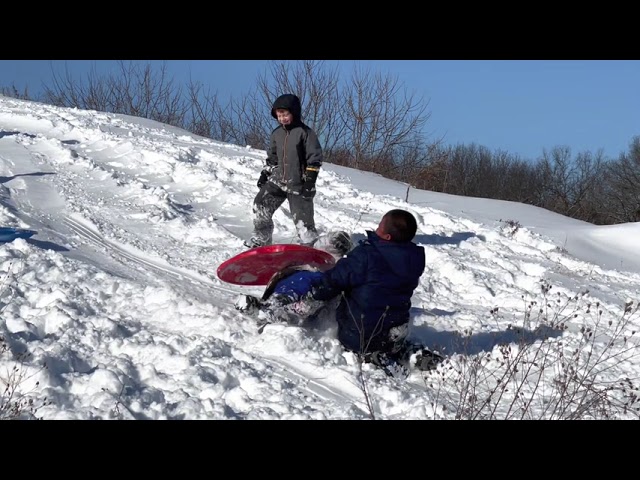 Sledding time with my brothers