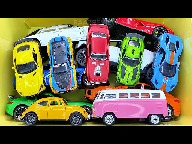 Box full of various miniature cars Peugeot, Volvo, Renault, Hyundai, Pagani, Cadillac One, DHL 13