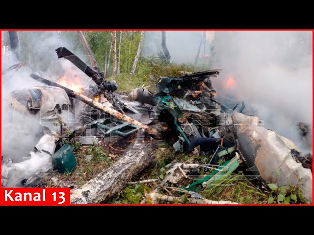 The crew members are all dead...- Russians try to put out the burning Mi-8 helicopter after crash