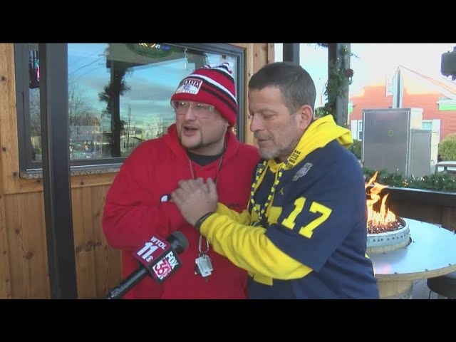 'Win or lose, it's love": Buckeye and Wolverine fans come together to watch rivalry game