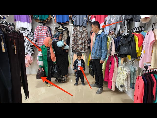 Kind shopkeeper: buying stylish clothes for a nomadic family