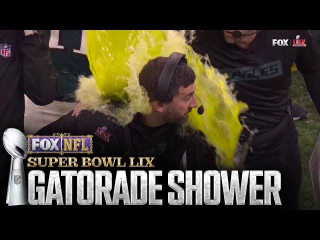 A.J. Brown and DeVonta Smith shower Nick Sirianni with Gatorade during Super Bowl LIX