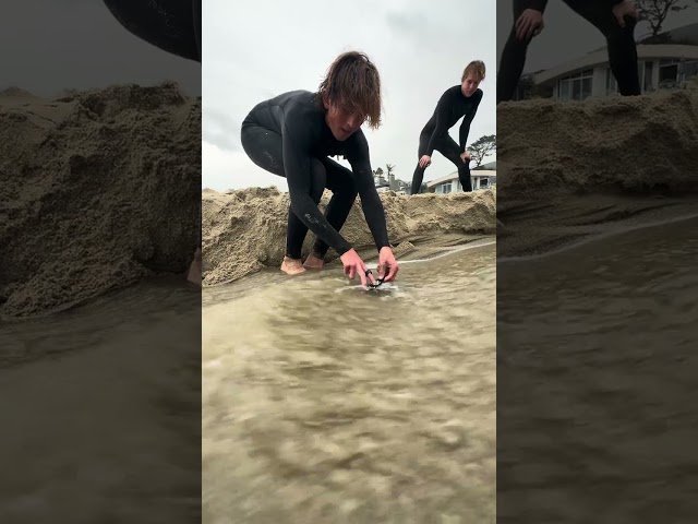 Little Kid Uses Toy To Ride A Wave