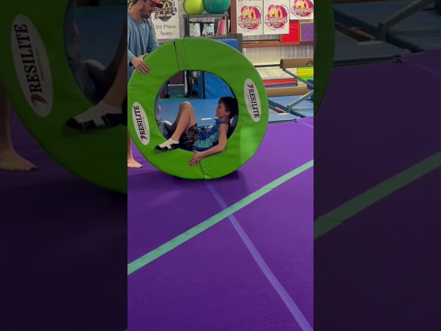 Kids Have Amazing Fun Rolling Around in Giant Green Rings