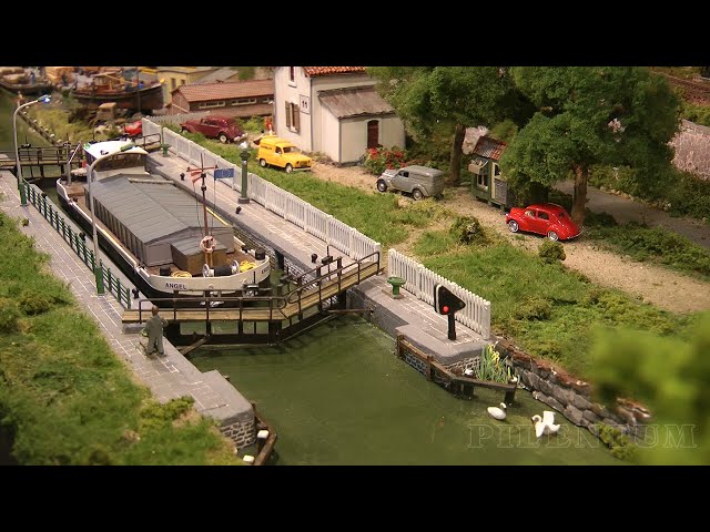 One of the best model railroad layouts with a lock for ships and with a perfect landscape design