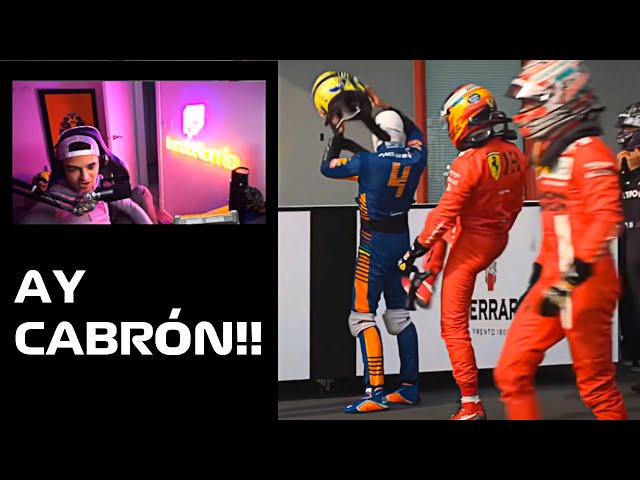 Lando Norris reacts to getting kicked by Carlos Sainz