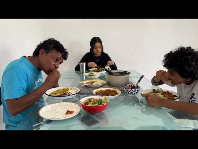 Fiji style cooking and eating prawn curry with dhal