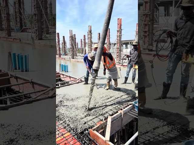 Pouring concrete for a second floor.