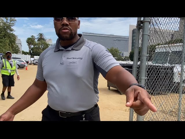 Tough beta male Security Guard  giving directives to move from sidewalk!!! Movie set flipping out