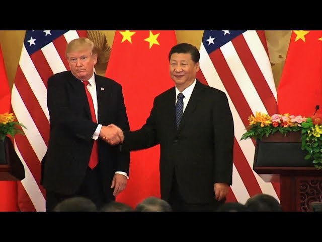 In China, Trump Talks Trade & North Korea, Ignoring Climate Change & Crackdown on Human Rights