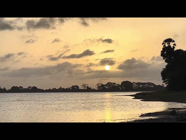 Golden Glories: Mesmerizing Sunrise Over Tranquil Lake in Anuradhapura Sri Lanka