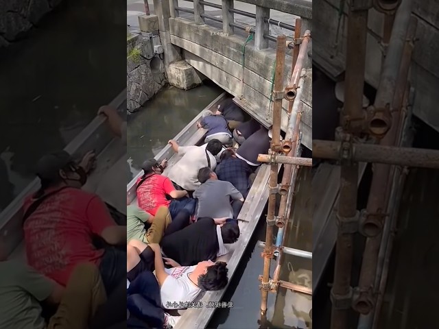 The old uncle who was steering the boat jumped onto the boat over the bridge